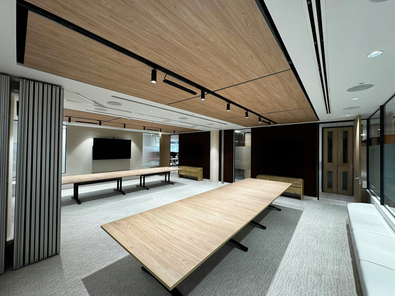 Wood-print acoustic ceiling across an open-plan office — client installation